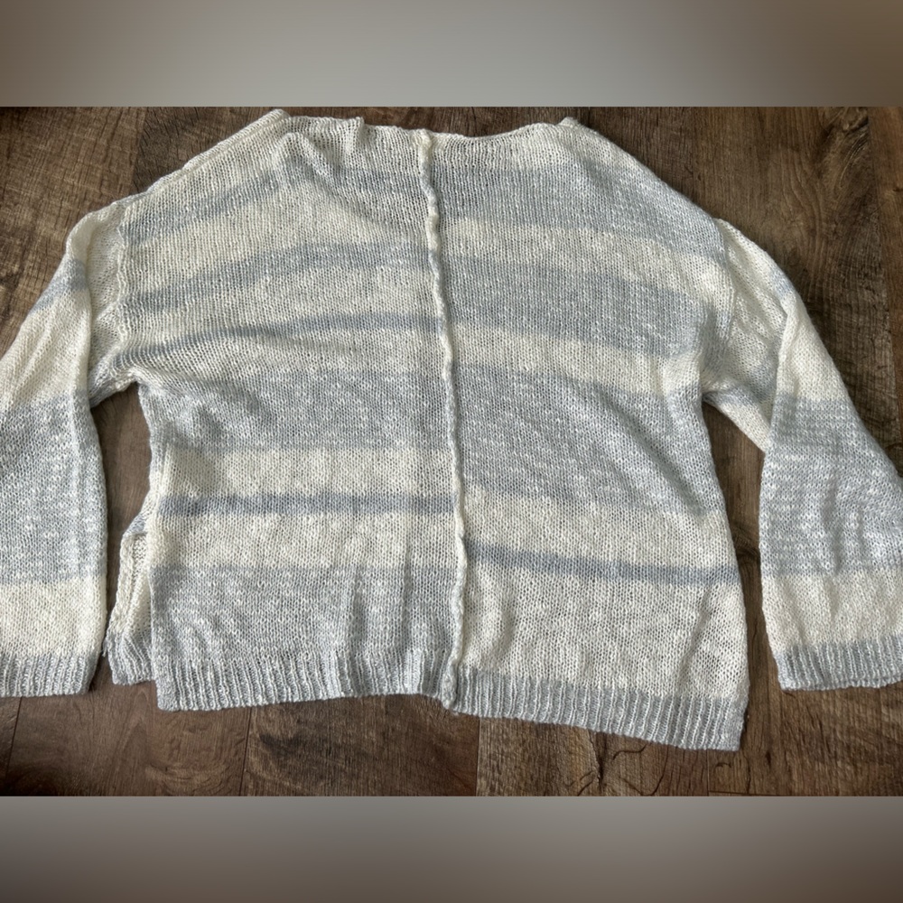 The buckle sweater